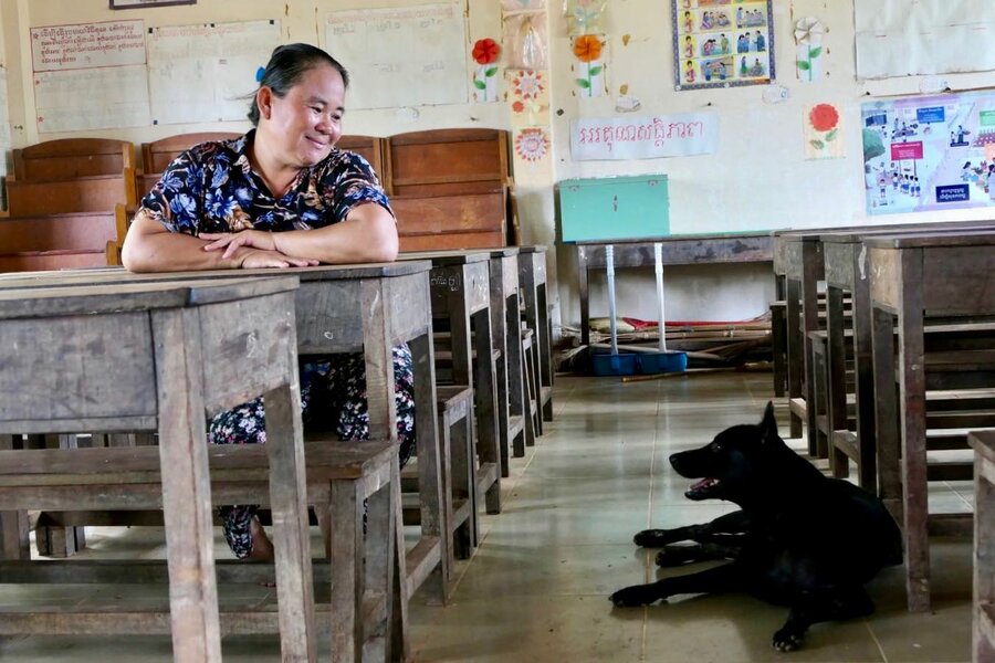 Seng in her classroom with a street dog who is adored by her pupils. Photo: WFP/Edward Johnson